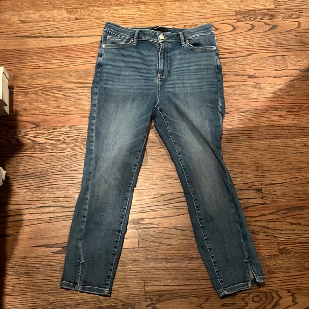 Vera Wang skinny jeans with slit cuts at the bottom. Great used condition